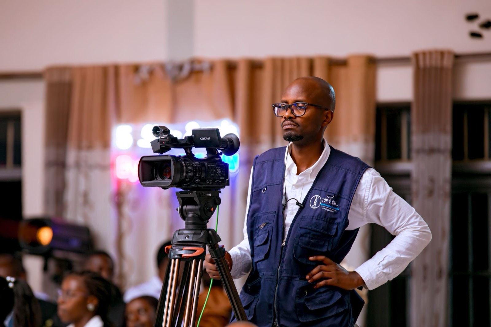 Camera operator filming an event